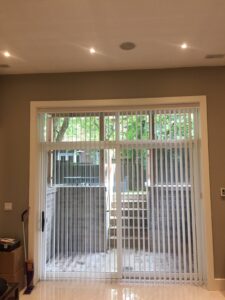 Patterned PVC Verticals on a Sliding Door Drawn and Open